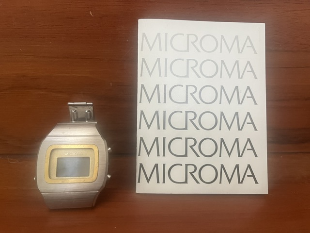 Microma LCD digital watch and brochure